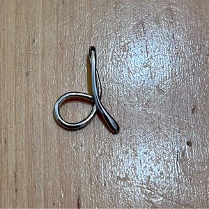 .925 sterling silver script letter D in lowercase.